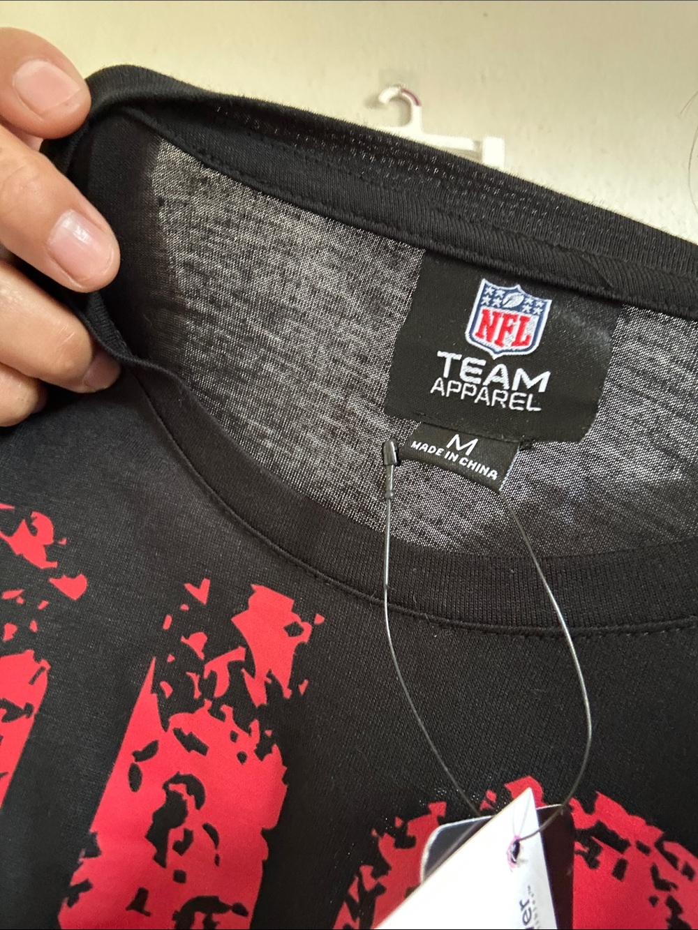 NFL Team Apparel Black T-Shirt with Red Graphic